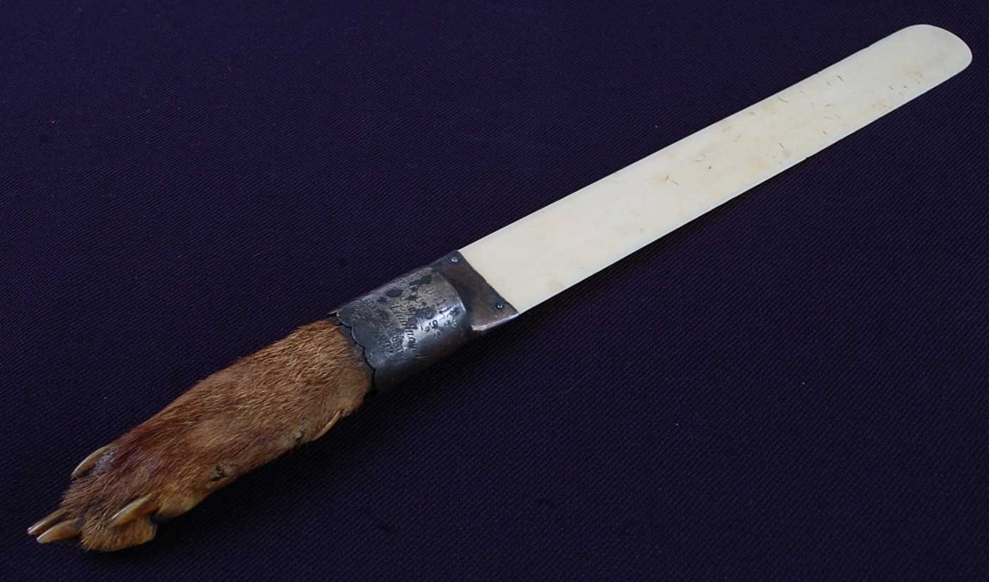 Lot 557 - * A late Victorian ivory page turner, mounted...