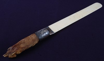 Lot 557 - * A late Victorian ivory page turner, mounted...
