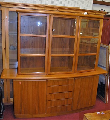 Lot 1099 - A Danish teak display cabinet, having three...