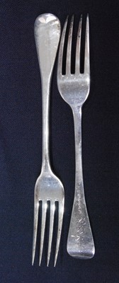 Lot 1154 - A set of five late Georgian silver table forks...