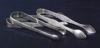 Lot 1159 - A pair of early George III silver sugar tongs,...
