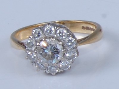 Lot 1204 - An 18ct yellow and white gold diamond circular...