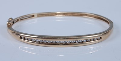 Lot 1196 - A yellow metal oval hinged hollow diamond...