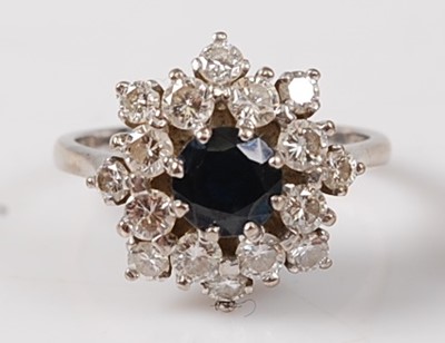 Lot 1250 - An 18ct white gold, sapphire and diamond...