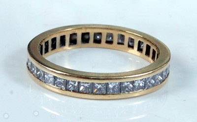 Lot 1251 - An 18ct yellow gold diamond full hoop eternity...