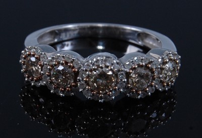 Lot 1258 - A 9ct white gold diamond half hoop eternity...