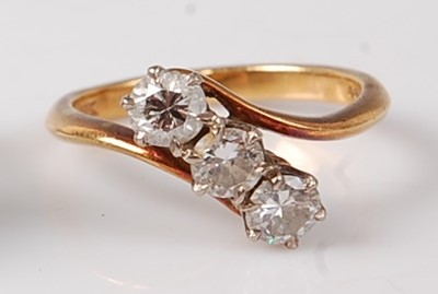 Lot 1241 - An 18ct yellow and white gold diamond three...