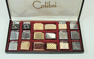 Lot 254 - A Colibri pocket cigarette lighter display...