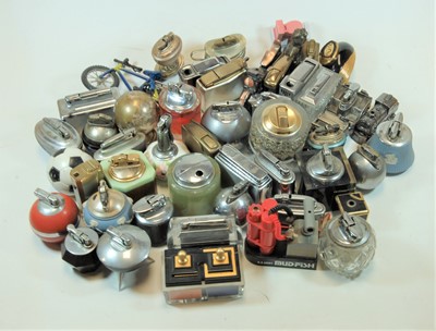 Lot 269 - A Piezo bike flame novelty table lighter,...