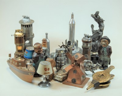 Lot 274 - A teak novelty table lighter in the from of a...