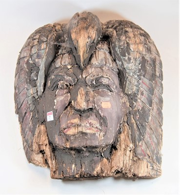 Lot 27 - A Native American carved softwood mask of a...