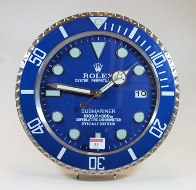 Lot 31 - A contemporary brushed aluminium wall clock in...
