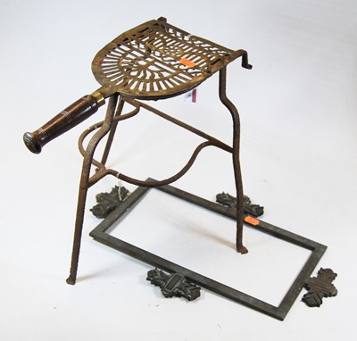 Lot 82 - A 19th century brass and iron trivet with...