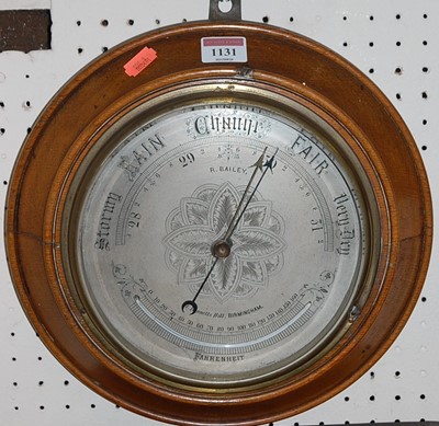 Lot 1131 - A circa 1900 oak cased circular aneroid...