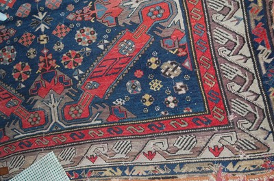 Lot 1150 - A Persian woollen blue ground Shiraz rug (with...