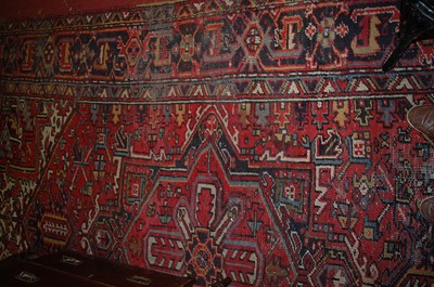 Lot 1151 - A Persian woollen red ground Shiraz rug (with...