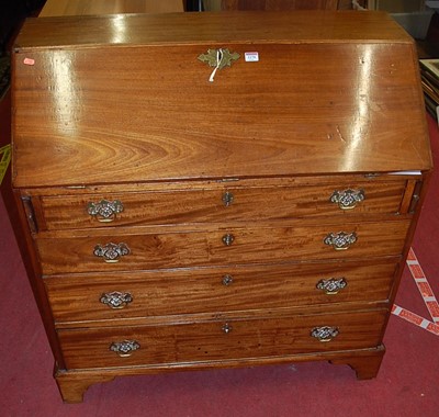 Lot 1170 - An early 19th century mahogany slopefront...