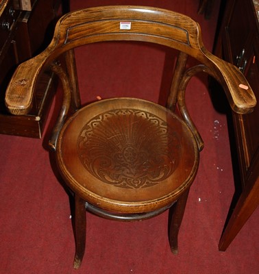 Lot 1186 - A circa 1900 bentwood tub elbow chair, in the...