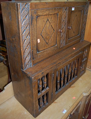 Lot 1195 - A joined oak hanging food cupboard, having...