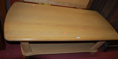 Lot 1203 - A contemporary light oak two-tier coffee table,...