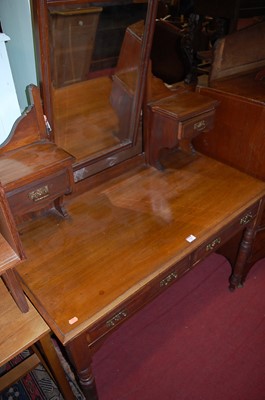 Lot 1216 - An Edwardian walnut swing mirrorback dressing...