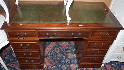 Lot 1245 - A contemporary mahogany and gilt tooled green...