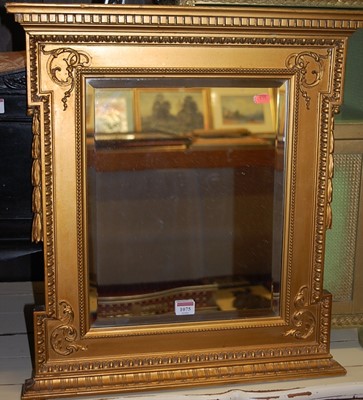 Lot 1075 - Circa 1900 gilt wood and gesso wall mirror...