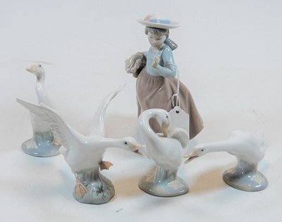 Lot 180 - A Nao Spanish porcelain figure of a girl,...