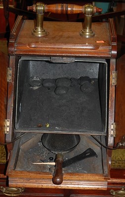 Lot 1250 - A late Victorian walnut twin door coal...