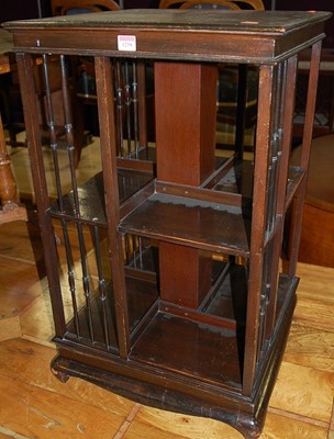 Lot 1258 - An Edwardian stained mahogany square revolving...