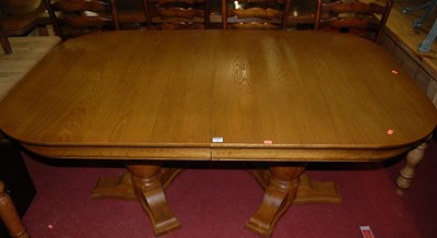 Lot 1269 - A contemporary oak twin pedestal round...