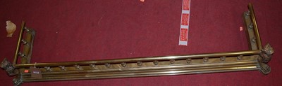 Lot 1270 - A late 19th century gilt brass fire fender,...