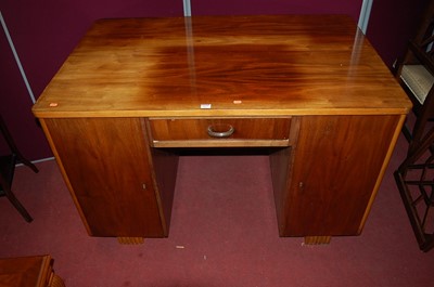 Lot 1277 - An Art Deco walnut round cornered kneehole...
