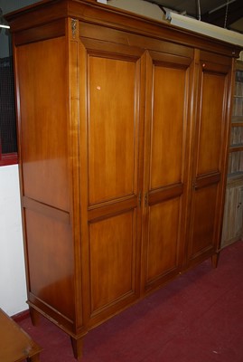 Lot 1148 - A contemporary French style cherry wood three...