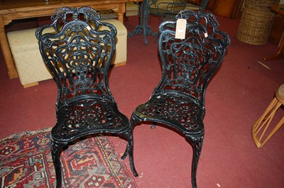 Lot 1283 - A set of six black painted cast and pierced...