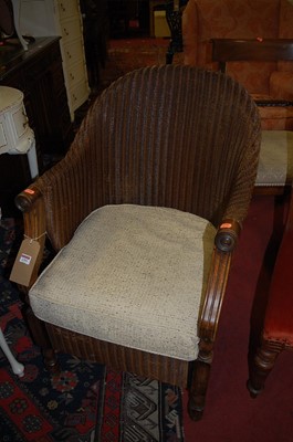 Lot 1293 - A contemporary oak framed and wicker tub...
