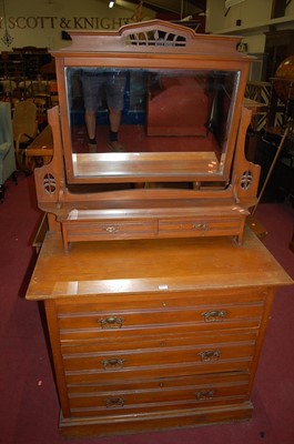 Lot 1317 - An Edwardian walnut swing mirror back dressing...