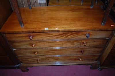 Lot 1324 - A 19th century mahogany chest of four long...