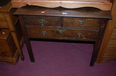 Lot 1329 - A provincial 19th century oak lowboy, having...