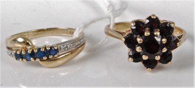Lot 321 - A modern 9ct gold, sapphire and diamond point...
