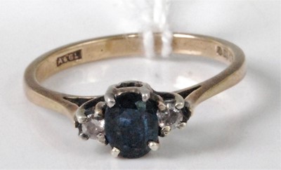 Lot 324 - A modern 9ct gold, four-claw set sapphire and...