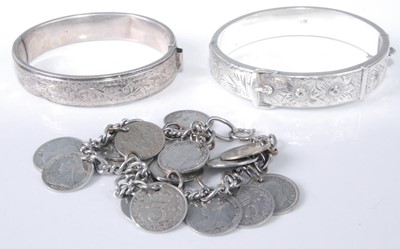 Lot 331 - Two modern silver hinged bangles; together...
