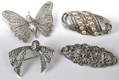 Lot 332 - Three marcasite set brooches; together with a...