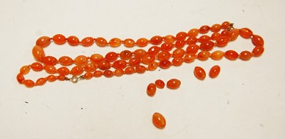Lot 428 - Two beaded and graduated orange glass necklaces