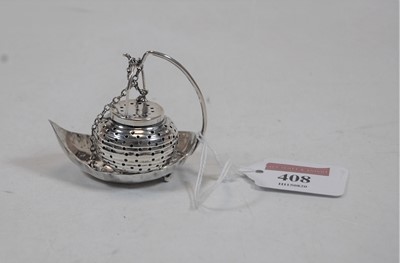 Lot 408 - A miniature sterling silver pomander, on leaf...