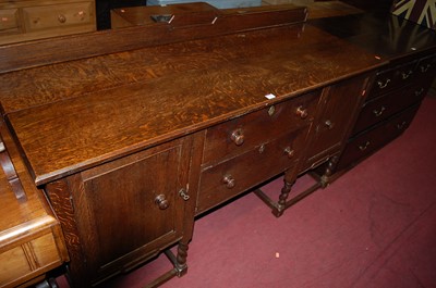 Lot 1355 - An early 20th century oak ledgeback sideboard,...