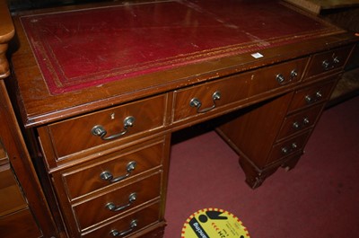 Lot 1360 - A reproduction mahogany and gilt tooled...
