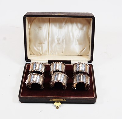 Lot 362 - A set of six Edwardian silver napkin rings,...