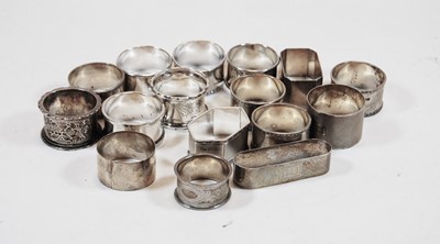 Lot 363 - A set of five George V silver napkin rings of...