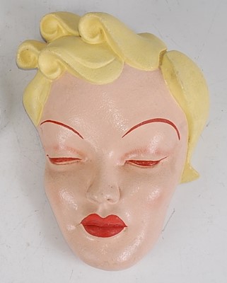 Lot 23 - A mid-20th century painted plaster stylised...
